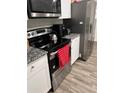 Modern kitchen with stainless steel appliances and granite countertops at 106 Orchid Ct, Kissimmee, FL 34759