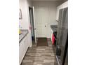 Kitchen with granite countertops, stainless steel appliances, and access to laundry at 106 Orchid Ct, Kissimmee, FL 34759