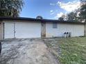 Ranch style home with a large attached garage and driveway at 1604 Royal Palm Dr, Edgewater, FL 32132