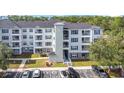 Three-story apartment building with ample parking at 3176 Feltrim Pl # 102, Kissimmee, FL 34747