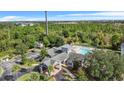 Lush landscaping surrounds the clubhouse and pool area at 3176 Feltrim Pl # 102, Kissimmee, FL 34747