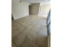 Spacious living room with neutral-toned tile flooring at 4106 Dijon Dr # 4106E, Orlando, FL 32808