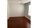 Dining room with dark wood laminate flooring and a chandelier at 4119 Dijon Dr # 4119H, Orlando, FL 32808