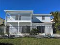 Two-story house with a pool, fenced backyard, and covered patio at 14716 Yorkshire Run Dr, Orlando, FL 32828