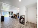 Bright entryway with wood-look tile floor, showing living area at 163 Lewfield Cir, Winter Park, FL 32792