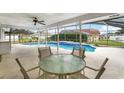 Relaxing pool area with patio furniture and screened enclosure at 1855 Cavalier Ct, Kissimmee, FL 34744