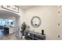 Bright and spacious entryway with a large mirror and view into the living area at 2914 Scarlett Dr, Saint Cloud, FL 34772