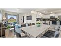 Bright dining area with large marble table and modern chairs at 3151 Paradox Cir # 201, Kissimmee, FL 34746
