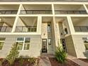 Contemporary townhome building with multiple units and brick accents at 9778 Bucklow Hill Dr, Orlando, FL 32832