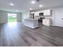Modern kitchen with stainless steel appliances and an island at 1030 Darlington Ct, Kissimmee, FL 34758