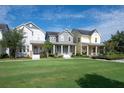 Row of colorful homes with welcoming porches and lush green lawns at 13913 Hahn Ln, Orlando, FL 32827