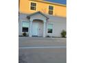 Two-story house with light beige walls and a white door at 210 Majors Ln # A, Kissimmee, FL 34743