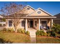 Charming one-story house featuring a covered entryway and neatly landscaped front yard at 2121 Black Mangrove Dr, Orlando, FL 32828