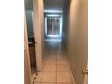 Bright hallway with tile flooring leading to bedrooms and bathroom at 2303 Walnut Canyon Dr, Kissimmee, FL 34758