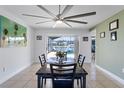 Bright dining area with a view of the pool and lake at 3209 Fairfield Dr, Kissimmee, FL 34743