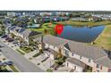 Townhome community near a lake and pool at 355 Highcrest Rd, Davenport, FL 33896