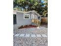 Gray house exterior with small front yard and stone pathway at 5413 Vanderlin St, Orlando, FL 32810
