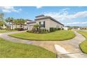 Well-maintained house with a side yard and curved sidewalk at 1880 Goblet Cove St, Kissimmee, FL 34746