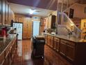 Spacious kitchen with granite counters and wood cabinets at 2606 Royal Fern Pl, Kissimmee, FL 34758