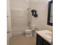 Clean bathroom with tub, toilet and vanity at 2857 Lyndscape St, Orlando, FL 32833