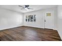 Bright and airy living room with hardwood floors and large windows at 527 Sunrise Dr, Orlando, FL 32803