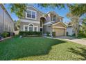 Two-story house with landscaping and a brick driveway at 9026 Dry Creek Ln, Orlando, FL 32832