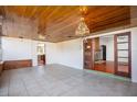 Bright sunroom with tile floors and access to the kitchen at 1109 Lakeshore Blvd, St Cloud, FL 34769