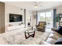 Spacious living room with large TV and comfy seating at 4741 Clock Tower Dr # 205, Kissimmee, FL 34746