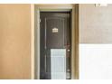 Condo building entrance with dark gray door and number 636 at 902 Charo Pkwy # 636, Davenport, FL 33897