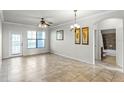 Spacious living room with tile floors and access to a balcony at 902 Charo Pkwy # 636, Davenport, FL 33897