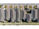 Aerial view of multiple houses with gray roofs and paved driveways at 12749 Brodlove Lane, Winter Garden, FL 34787