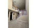 Two-story home interior with open staircase and high ceilings at 2018 Gold Spring Cv, Kissimmee, FL 34743