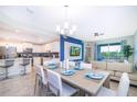 Open concept kitchen and dining area with modern appliances and seating at 3150 Paradox Cir # 208, Kissimmee, FL 34746