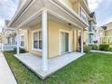 Covered patio with white columns and sliding glass door at 4012 Santa Maria # 101, Kissimmee, FL 34741