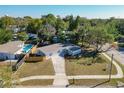 Aerial view of a charming home with a private pool and well-manicured lawn at 101 Gerry Dr, Altamonte Springs, FL 32714