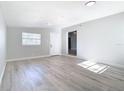Bright living room featuring light gray walls and modern wood-look flooring at 101 Gerry Dr, Altamonte Springs, FL 32714