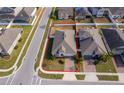 An aerial view showcasing a house and its surrounding lot at 1721 Sunfish St, St Cloud, FL 34771