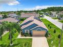 This single-Gathering home features a solar panel system and a spacious yard at 204 Fox Loop, Davenport, FL 33837