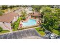 Community pool and surrounding buildings at 2602 Lemon Tree Ln # H, Orlando, FL 32839