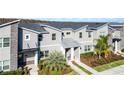 Attractive townhome with gray siding and landscaping at 4297 Paragraph Dr, Kissimmee, FL 34746