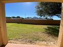View of the grassy backyard and surrounding neighborhood at 467 La Mirage St, Davenport, FL 33897