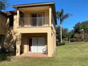 Private patio and balcony with access from ground floor and upper level at 467 La Mirage St, Davenport, FL 33897