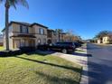 Townhome community view, showing a black SUV parked in front of the property at 467 La Mirage St, Davenport, FL 33897