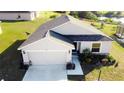 Single-story house with a two-car garage and a large front yard at 326 Dinner Lake Ct, Lake Wales, FL 33859