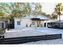 Contemporary home with a clean design, modern fence, and gravel landscaping at 803 E 11Th Ave, New Smyrna Beach, FL 32169