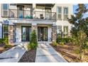 Modern two-story townhome with private balcony and landscaped grounds at 1800 Houston St, Kissimmee, FL 34743