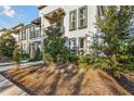 Modern townhome community with manicured landscaping and walkways at 1800 Houston St, Kissimmee, FL 34743