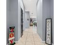 Welcoming entryway with tiled flooring, holiday decor, and a view into the living area at 3907 Baja Dr, St Cloud, FL 34772