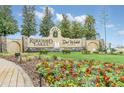 Ridgewood Lakes community entrance with a sign and landscaping at 1020 Golf Course Pkwy, Davenport, FL 33837