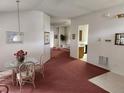 Open concept dining area leading to living room and kitchen at 2528 Chatham Cir, Kissimmee, FL 34746